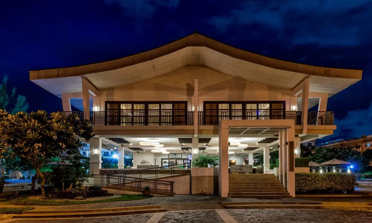Multistory clubhouse at Cedar Crest lit at night, DMCI Homes condo amenity in Acacia Estates, Taguig City, actual photo