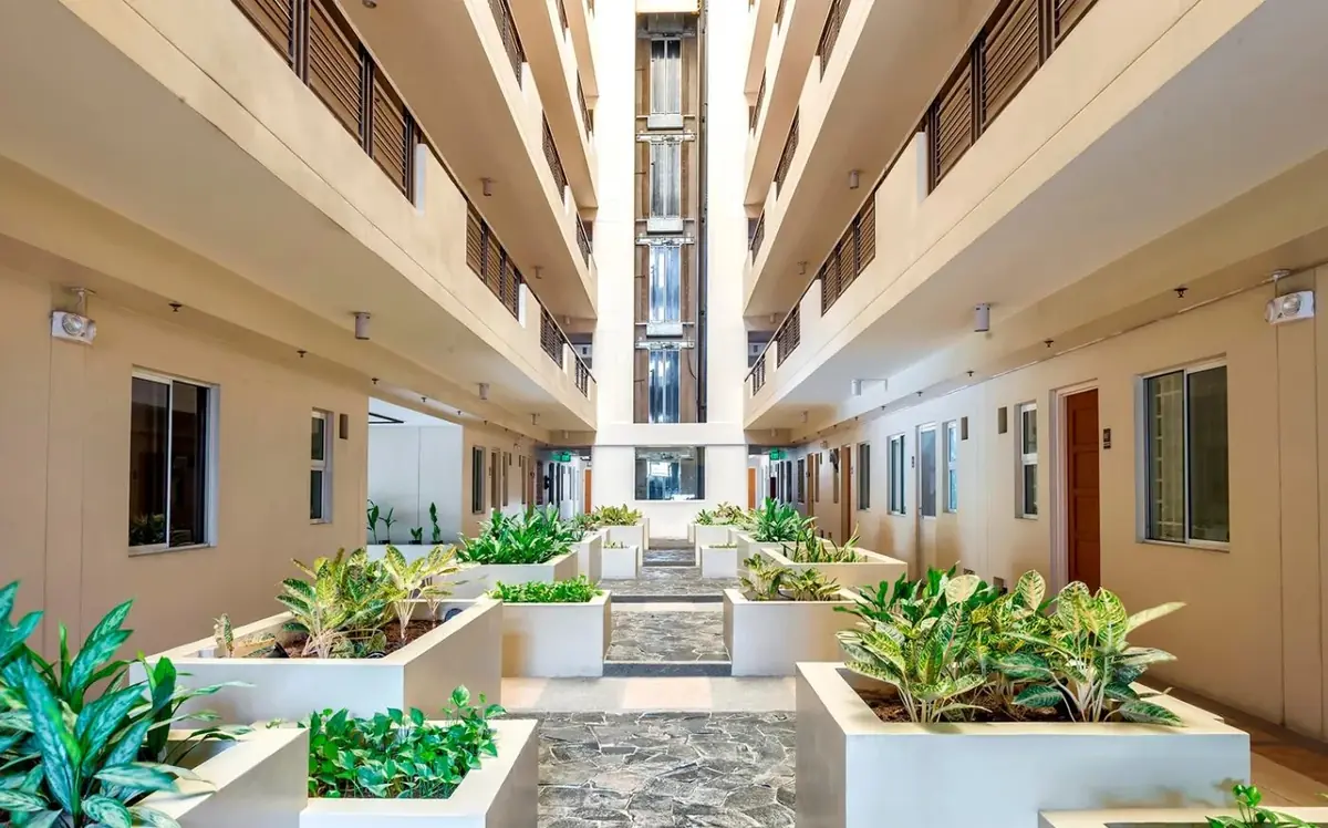 Landscaped garden atrium corridor inside a Cedar Crest building, DMCI Homes condo in Acacia Estates, Taguig City, actual photo