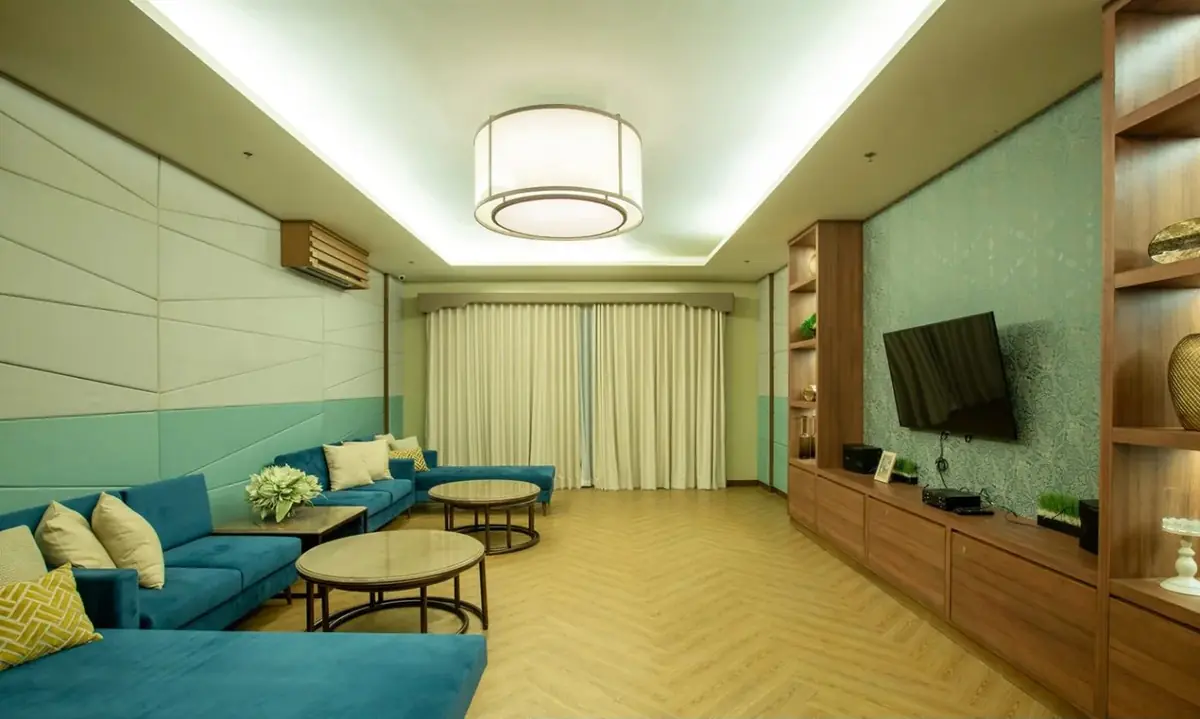 Maple Place audio visual room with sofa seating and TV, DMCI Homes condo amenity in Acacia Estates, Taguig City, actual photo